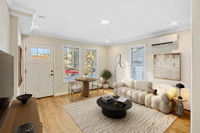 a view of a house with a small deck