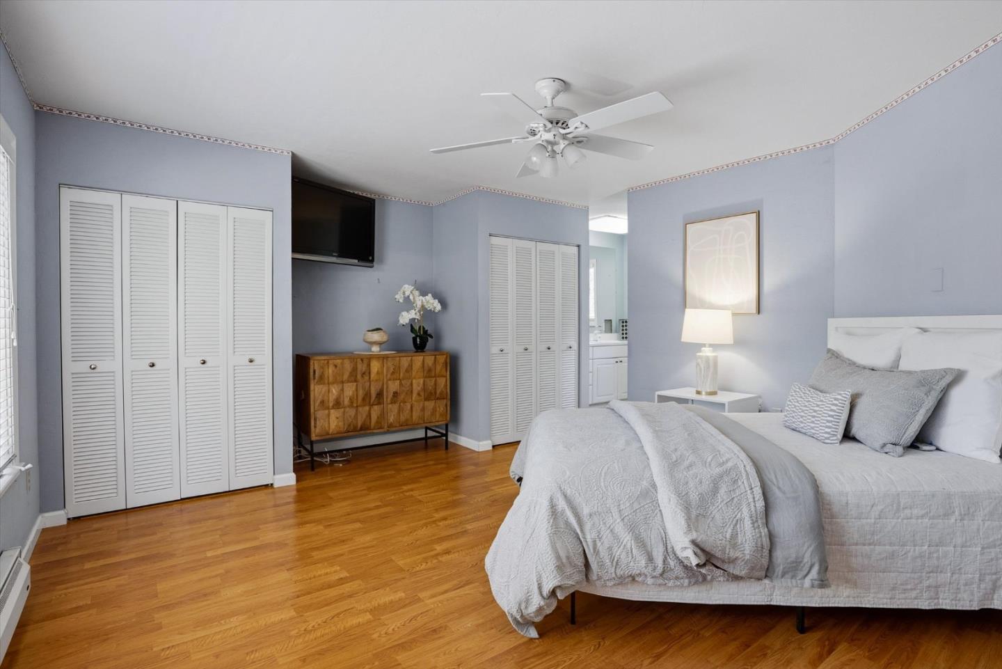 16899 Kennedy Road Los Gatos, CA 95032 - Photo 45 of 61 a bedroom with a bed and wooden floor