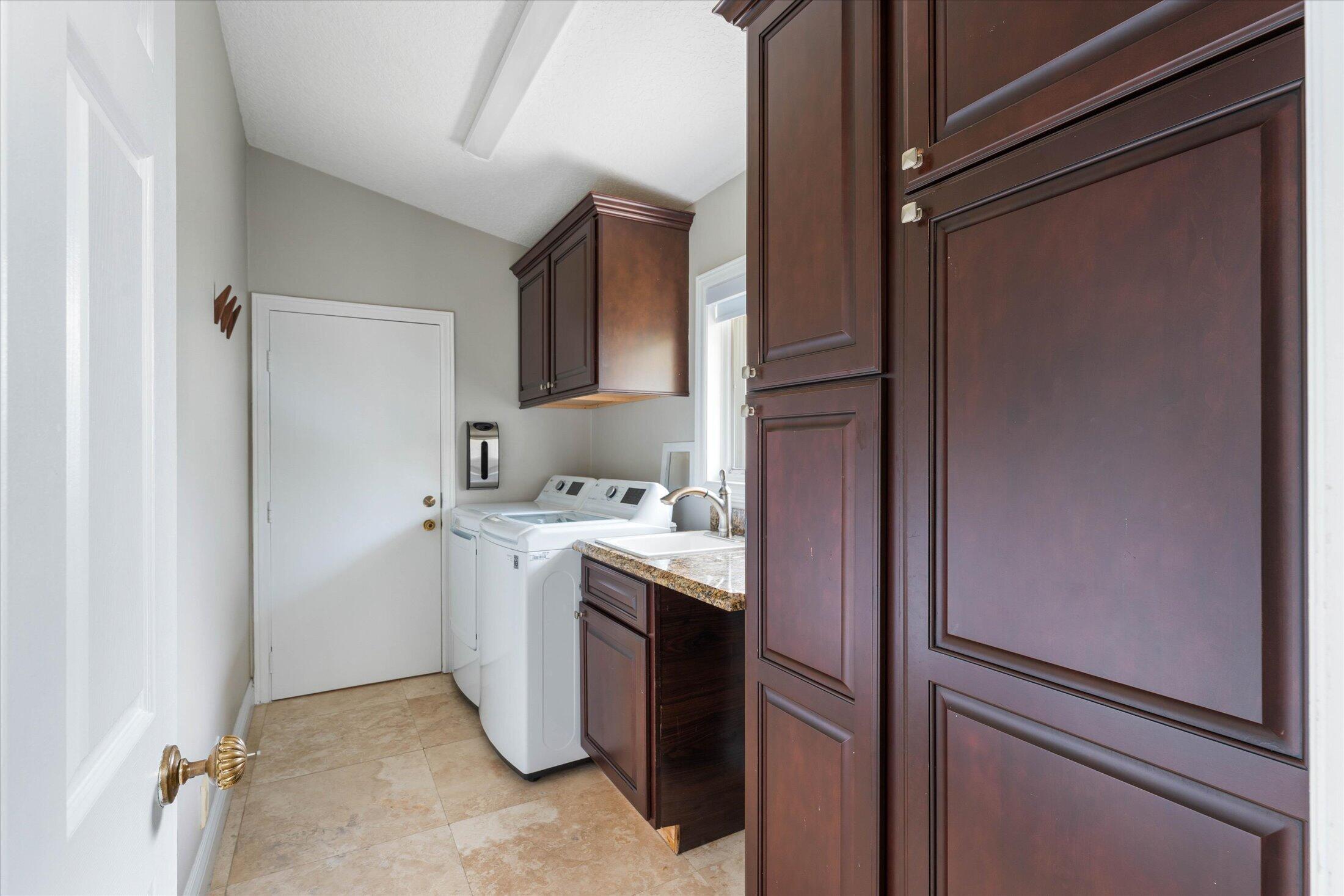 1598 Southwest 5th Avenue Boca Raton, FL 33432 - Photo 24 of 36 Laundry Room with Sink and Storage