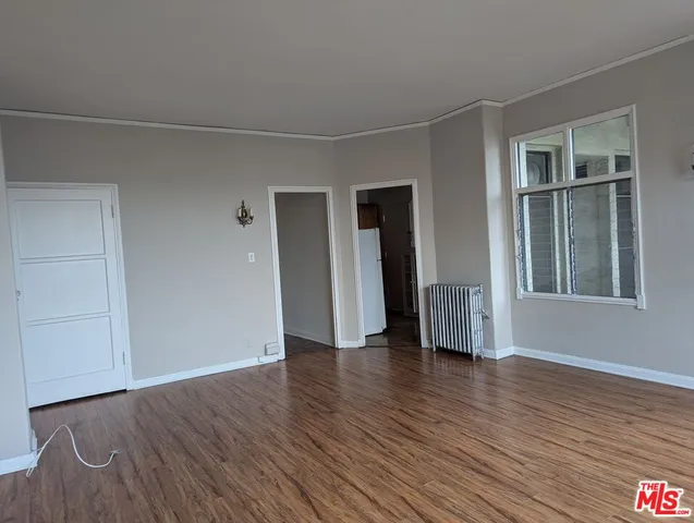 a kitchen with stainless steel appliances granite countertop a sink and a refrigerator
