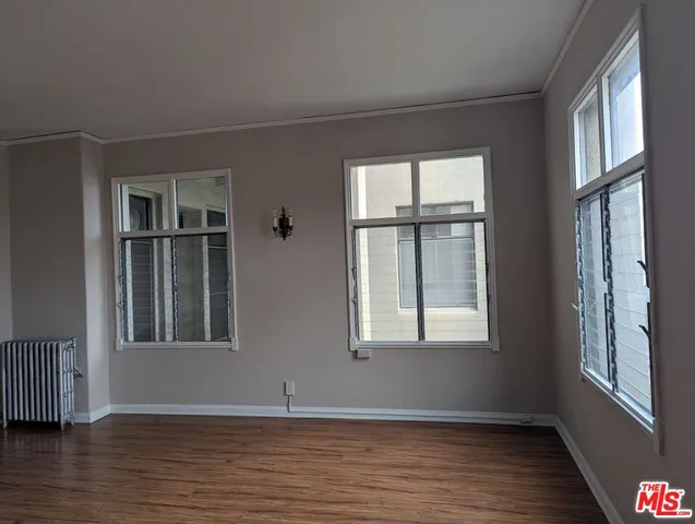 a kitchen with a refrigerator and a stove