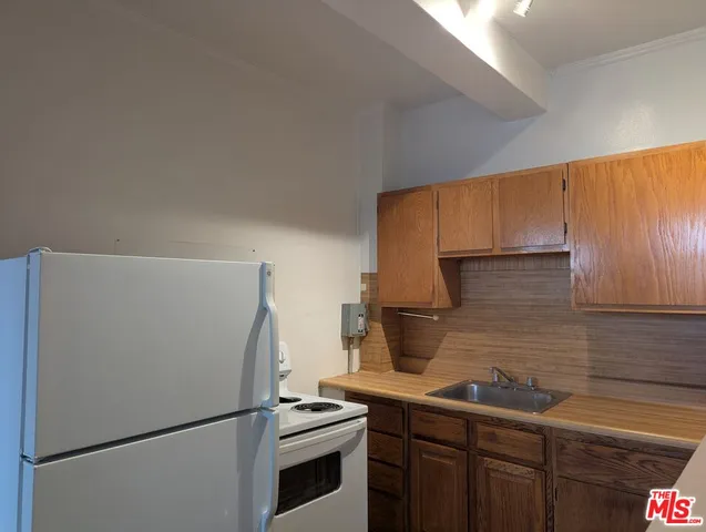 a view of a room with shelves on the wall