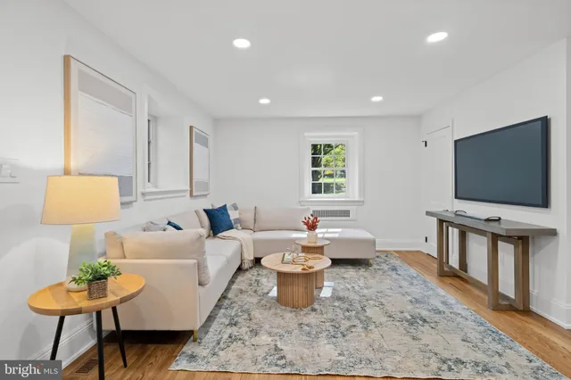 a kitchen with white cabinets and appliances