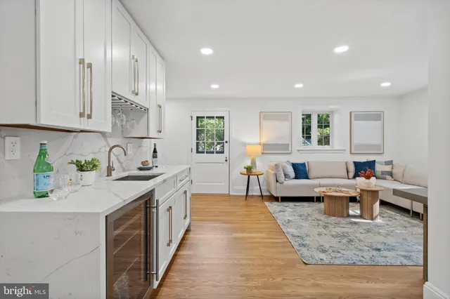 a view of a dining room with furniture and a potted plant