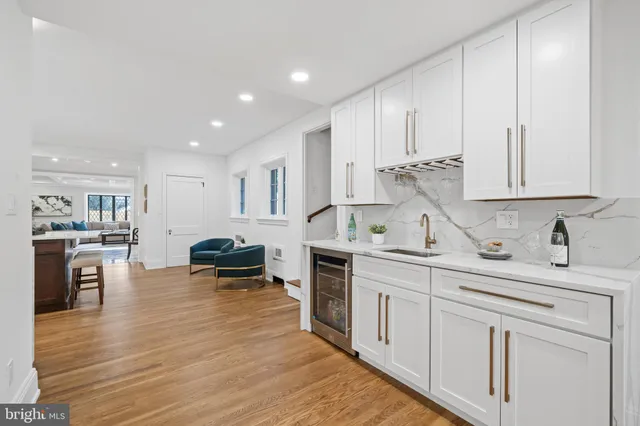 a bathroom with a sink vanity and mirror
