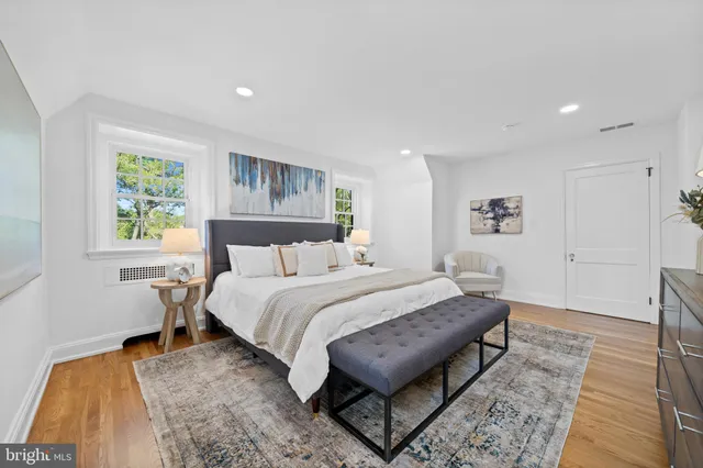 a white bath tub sitting in a bathroom and a bathtub