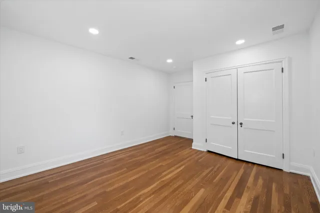 a view of a hallway with washer and dryer