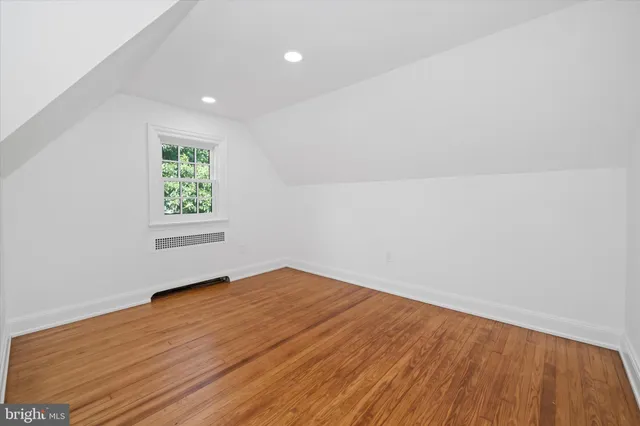 a view of a room with wooden walls