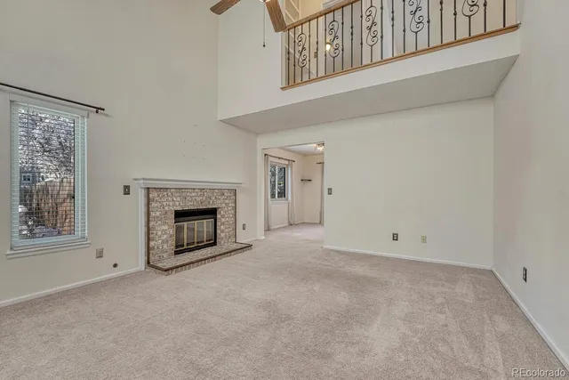 an empty room with a fireplace