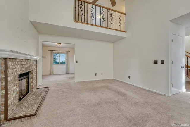 a view of empty room with a fireplace