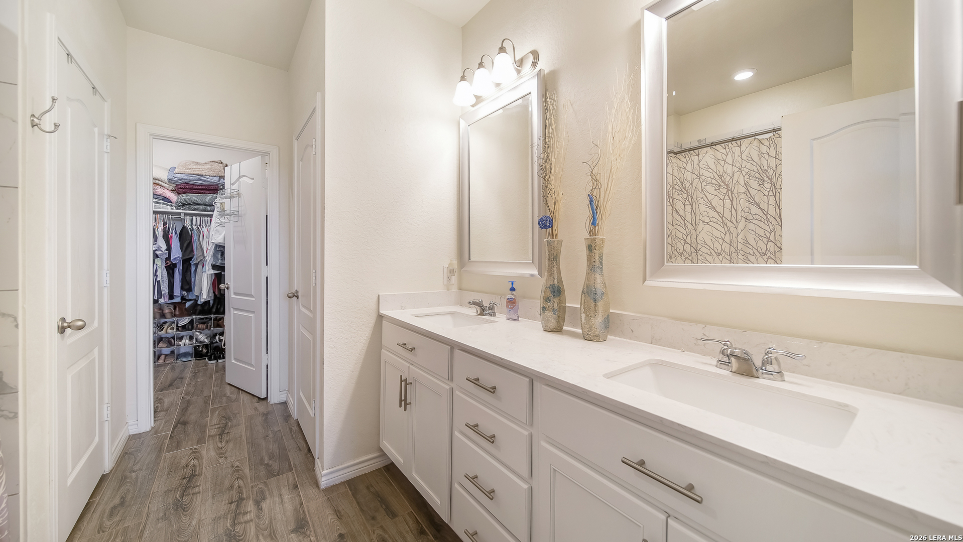 350 Colonial Bluff Universal City, TX 78148 - Photo 11 of 27 a spacious bathroom with a double vanity sink a mirror and shower