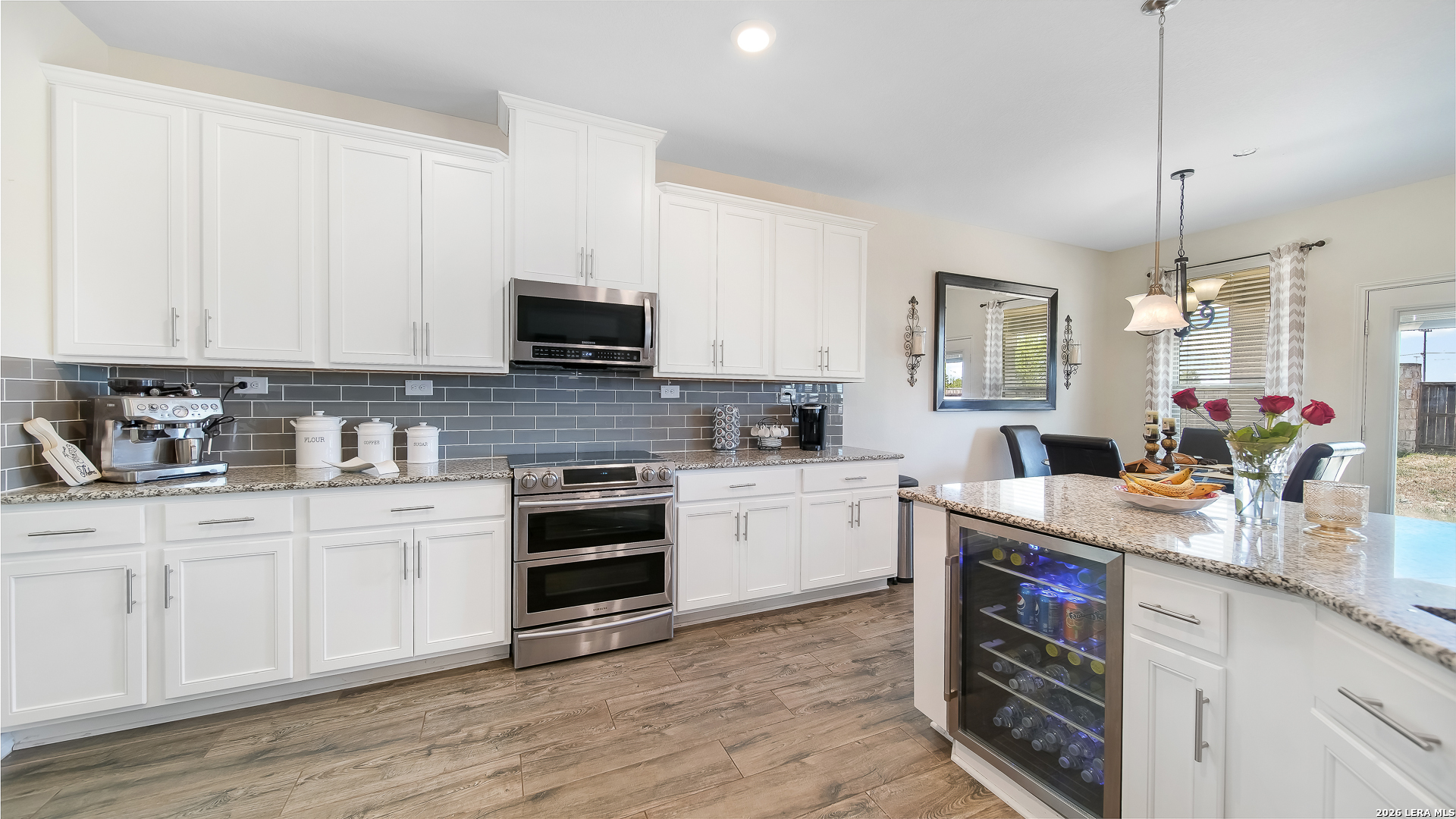 350 Colonial Bluff Universal City, TX 78148 - Photo 14 of 27 a kitchen with stainless steel appliances granite countertop a stove sink and cabinets