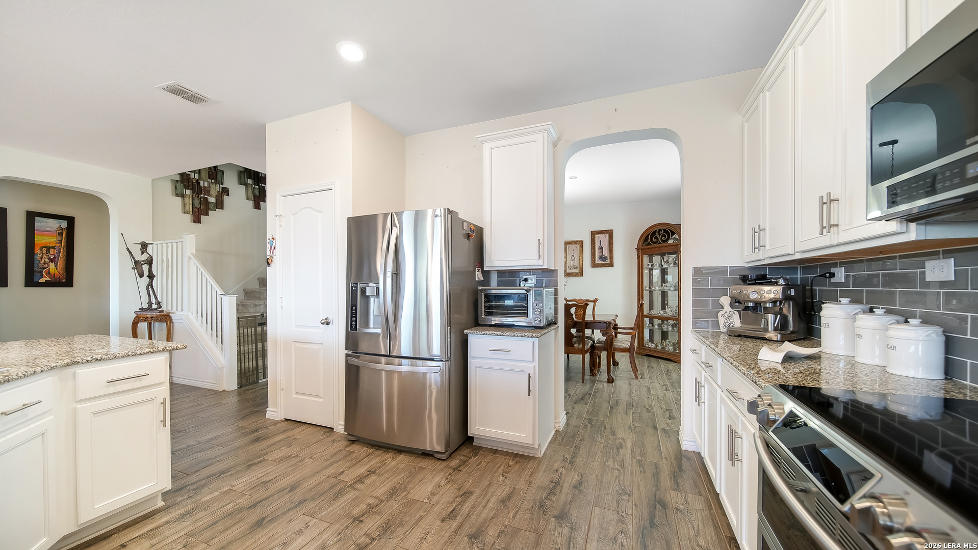 350 Colonial Bluff Universal City, TX 78148 - Photo 15 of 27 a kitchen with stainless steel appliances a refrigerator stove microwave and cabinets