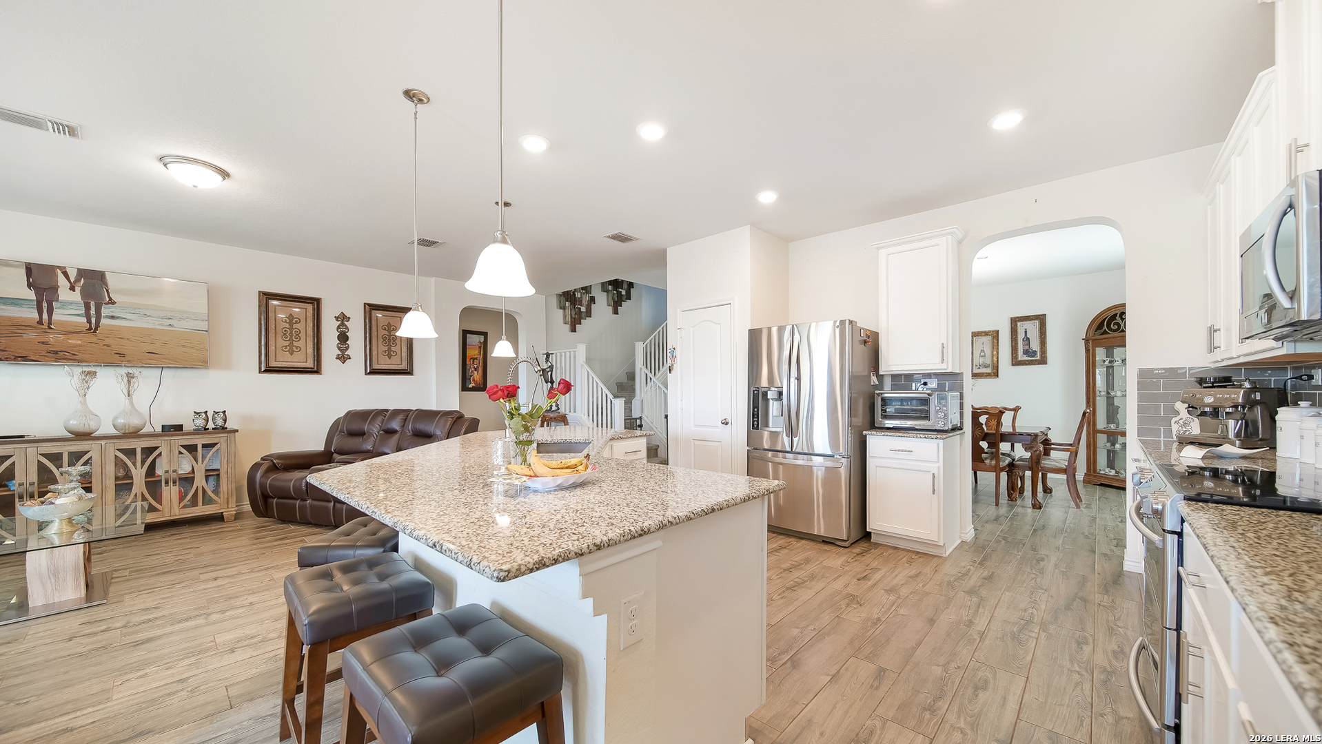 350 Colonial Bluff Universal City, TX 78148 - Photo 16 of 27 a large kitchen with sink a refrigerator and chairs