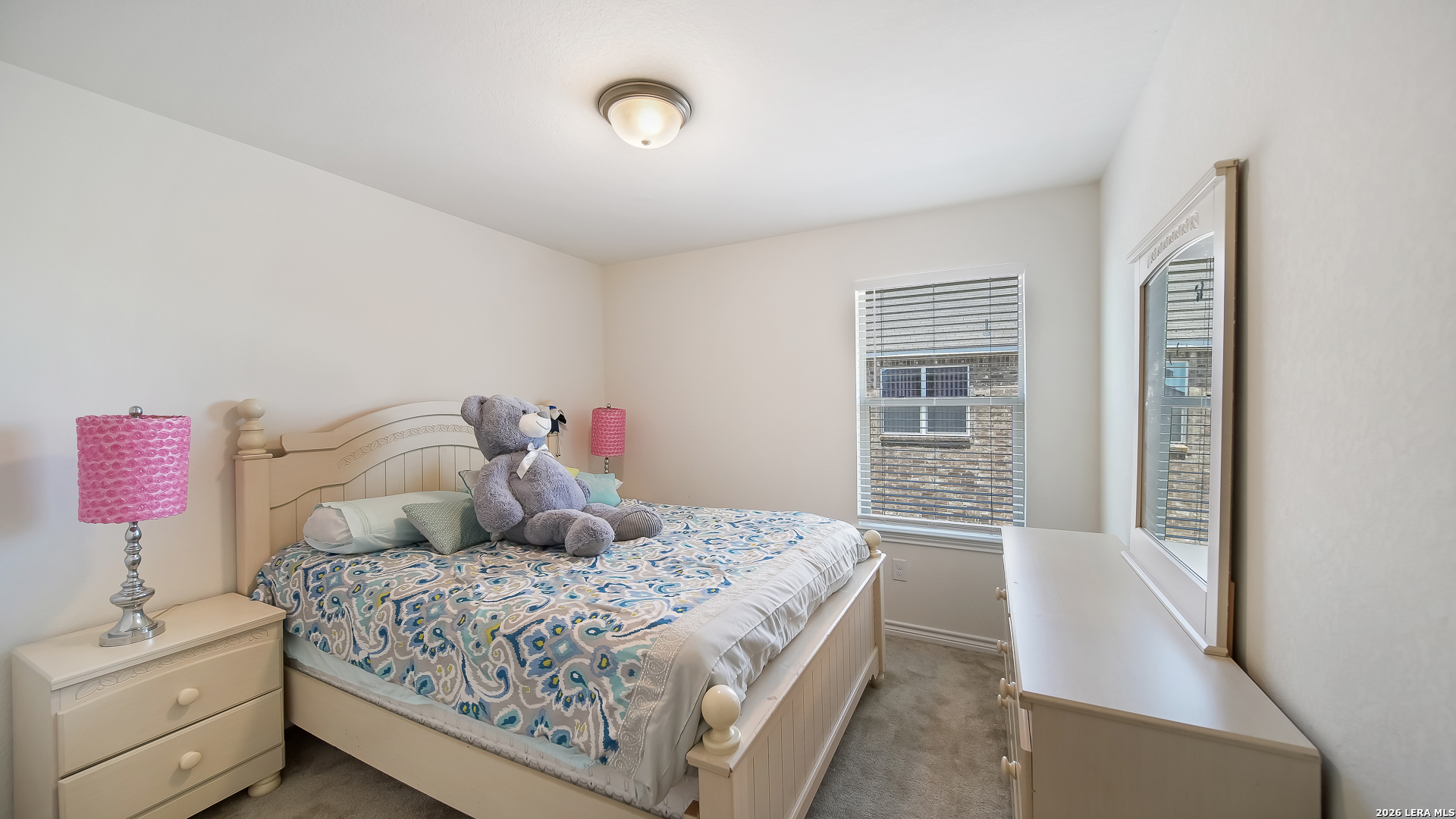 350 Colonial Bluff Universal City, TX 78148 - Photo 21 of 27 a bedroom with a large bed and a window