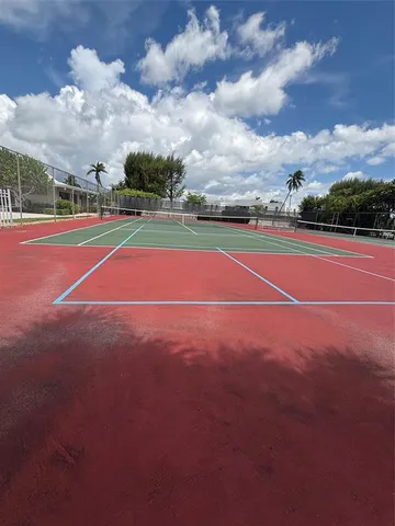 a view of an outdoor space and tennis court