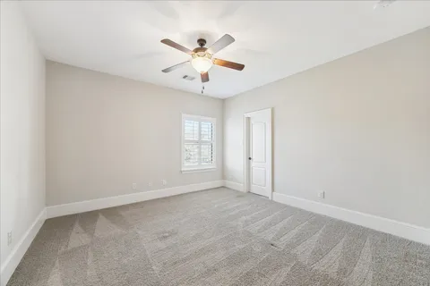 a view of a swimming pool with outdoor seating