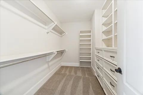 a view of a house with swimming pool and sitting area