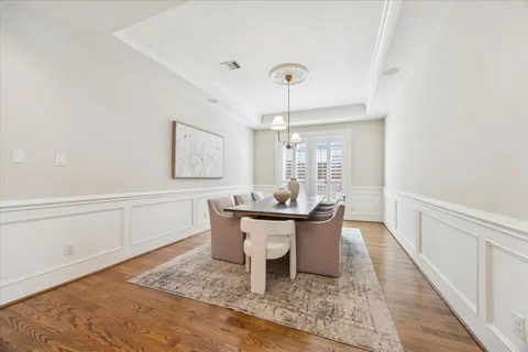 a living room with furniture fireplace and a large window