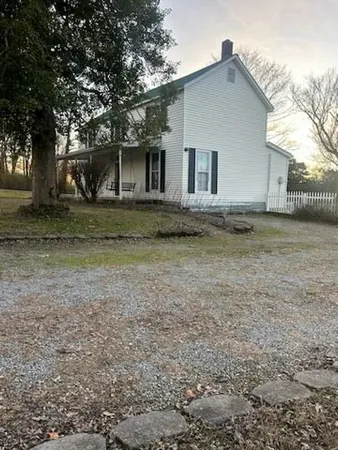 a view of a house with a back yard