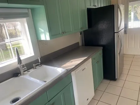 a bathroom with a sink and a washing machine