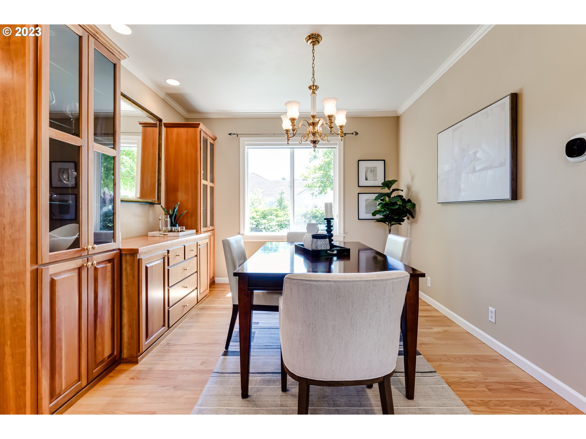 2572 Walnut Ridge Drive Springfield, OR 97477 - Photo 8 of 47 a dining room with furniture a chandelier and wooden floor