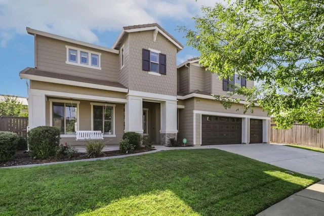 front view of a house with a yard