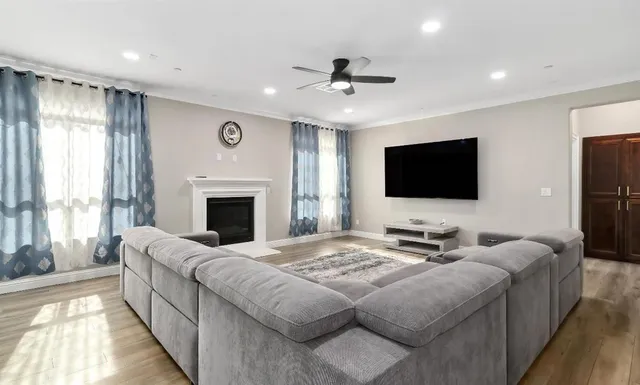 a living room with furniture window and a fireplace