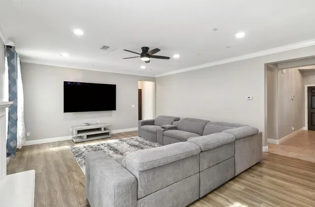 a kitchen with stainless steel appliances kitchen island granite countertop a sink and cabinets