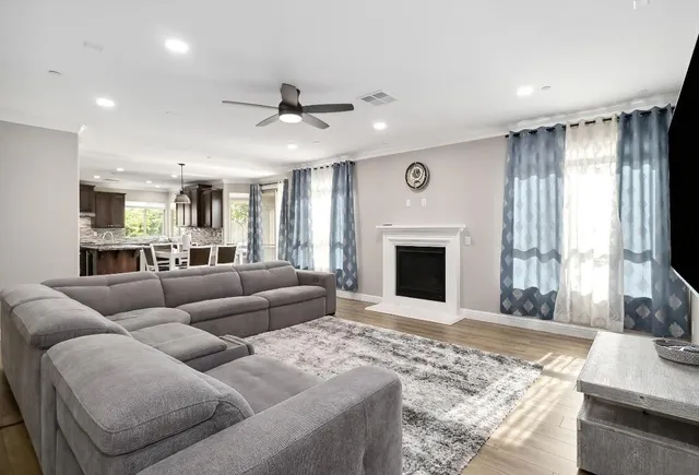 a kitchen with stainless steel appliances granite countertop wooden cabinets a sink and a stove