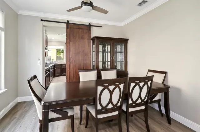 a spacious bedroom with a bed and a large window