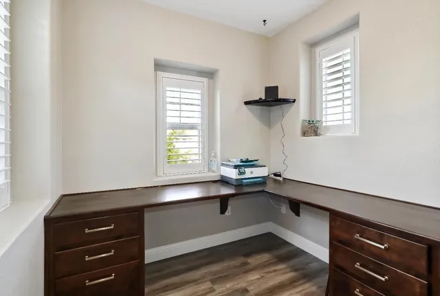a spacious bedroom with a bed and a chandelier