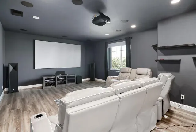 a bedroom with a bed and a ceiling fan