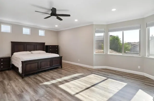 a bathroom with a granite countertop sink double vanity and a mirror