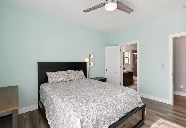 a room with a bed and window