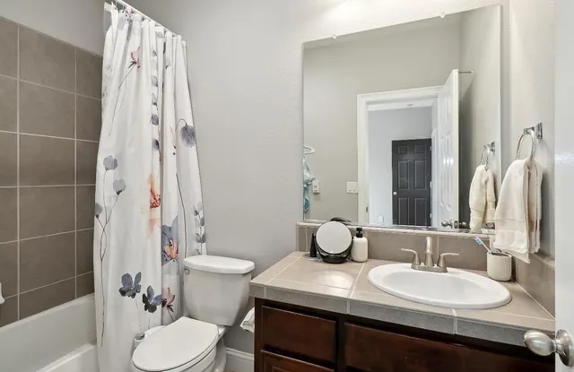 a view of a backyard with plants and patio