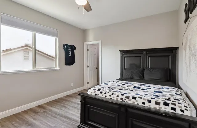 a view of a house with a yard and porch with a garden