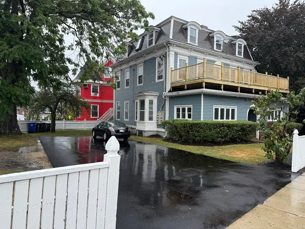 a view of deck with table and chairs and wooden floor