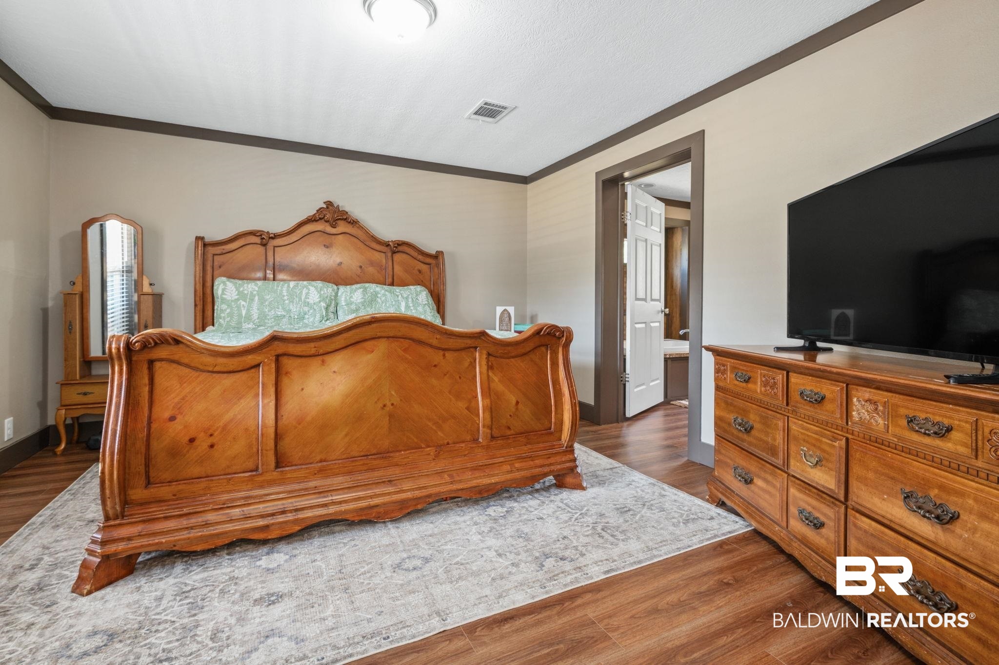 15080 Starlight Avenue Wilmer, AL 36587 - Photo 15 of 29 Bedroom with ornamental molding and dark hardwood / wood-style floors