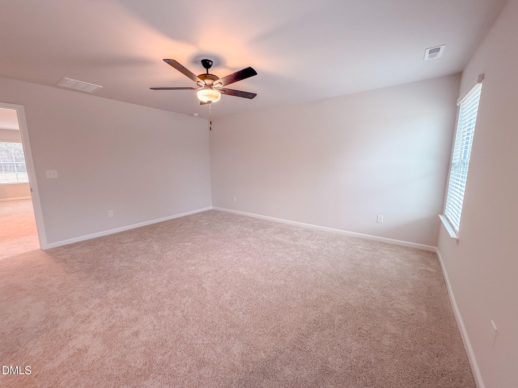 460 Beacon Hl Road Lillington, NC 27546 - Photo 26 of 48 an empty room with a window and a fan