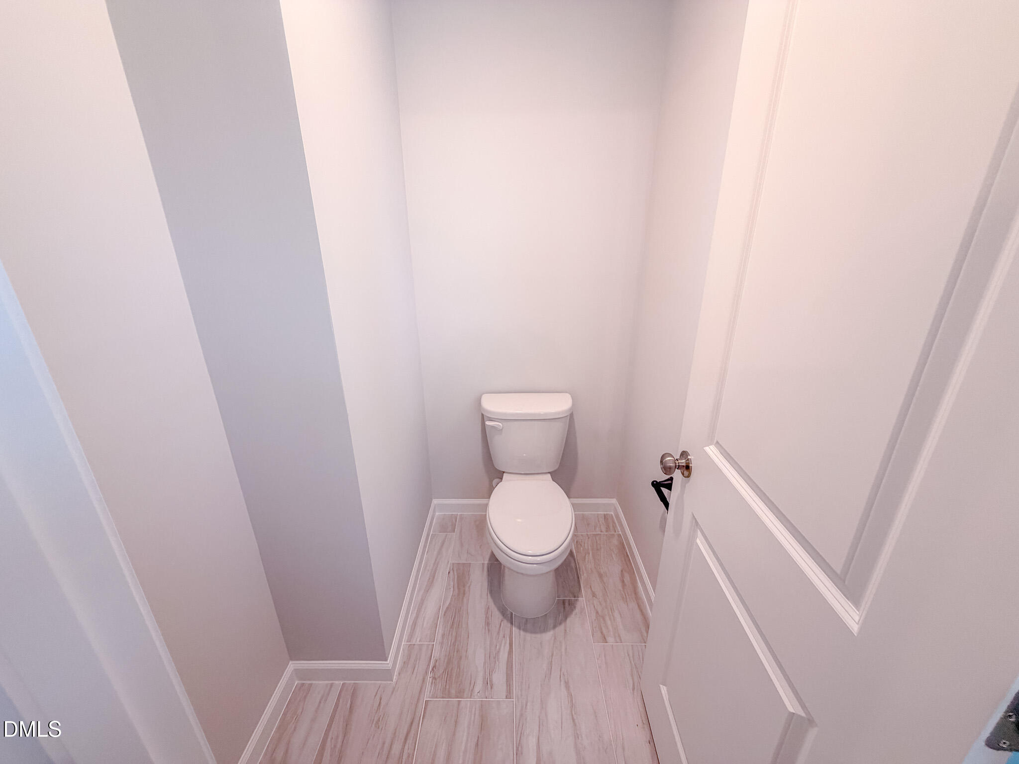 460 Beacon Hl Road Lillington, NC 27546 - Photo 34 of 48 a white toilet sitting next to a shower