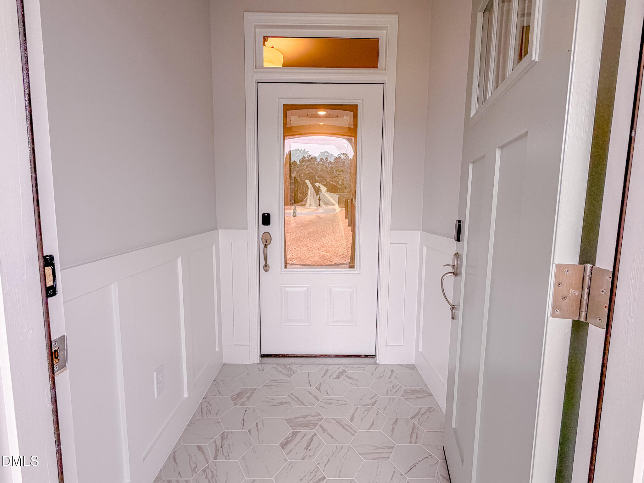 460 Beacon Hl Road Lillington, NC 27546 - Photo 4 of 48 a view of a hallway with wooden floor and a door