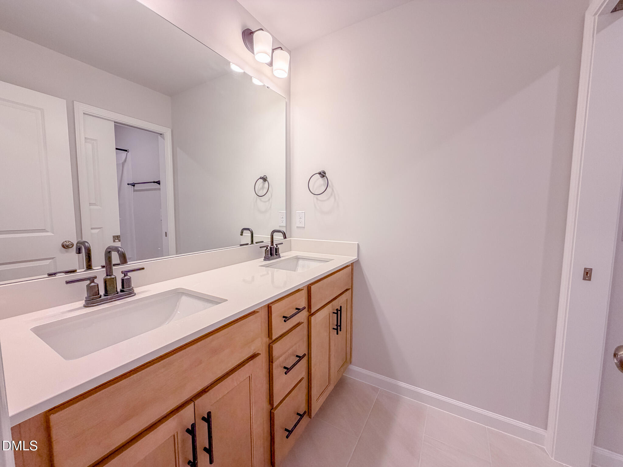 460 Beacon Hl Road Lillington, NC 27546 - Photo 42 of 48 a bathroom with a sink double vanity and a mirror