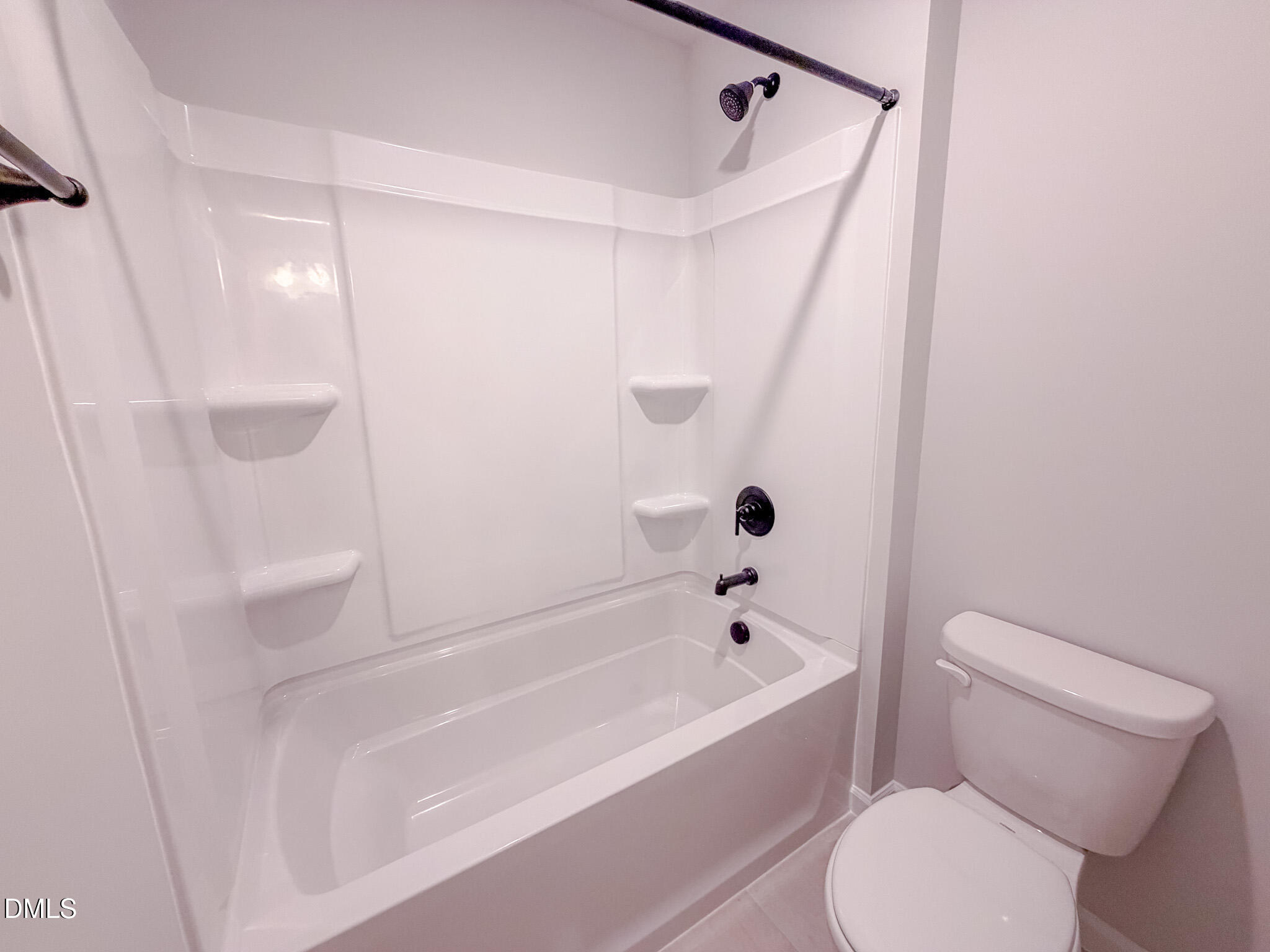 460 Beacon Hl Road Lillington, NC 27546 - Photo 45 of 48 a bathroom with a toilet and a bathtub