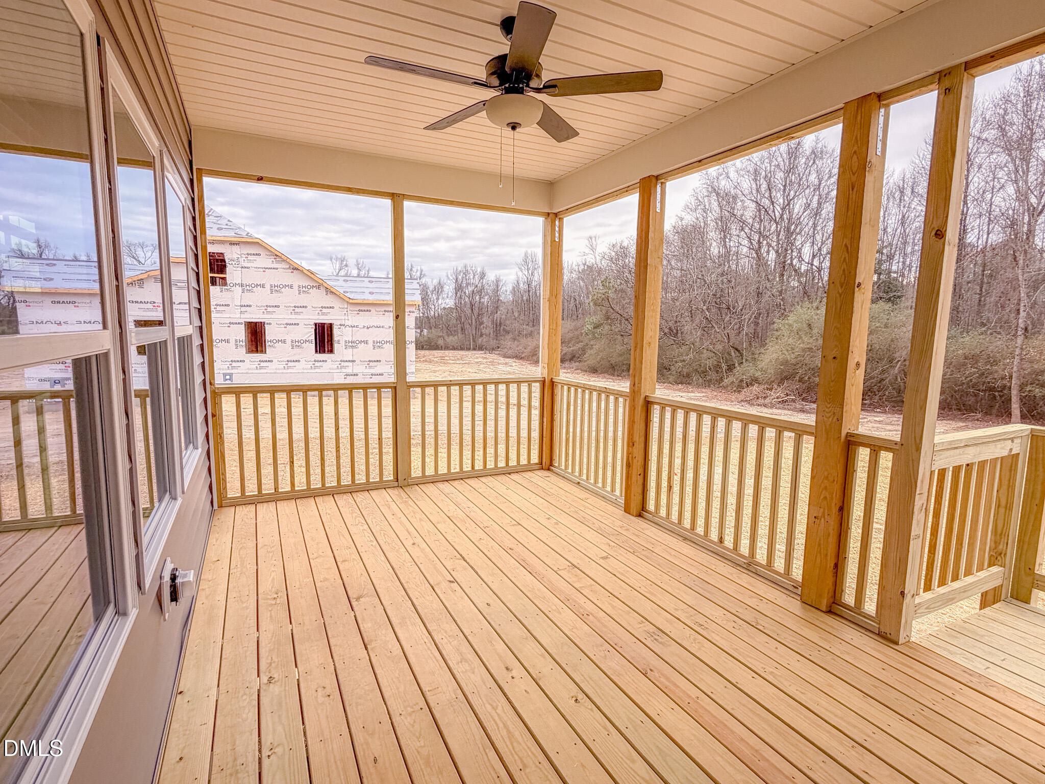 460 Beacon Hl Road Lillington, NC 27546 - Photo 46 of 48 a view of a wooden deck with a outdoor space