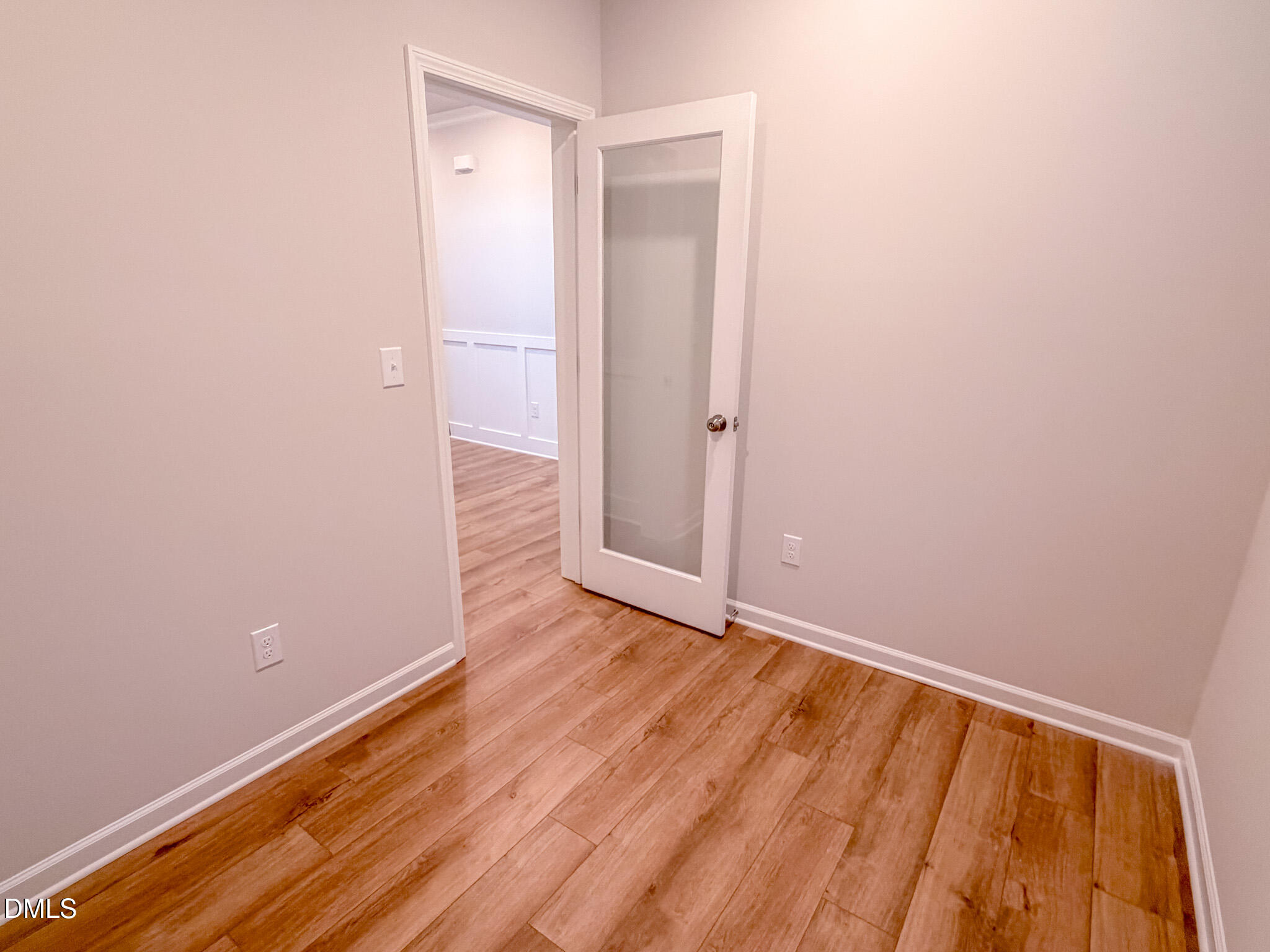 460 Beacon Hl Road Lillington, NC 27546 - Photo 8 of 48 a view of an empty room with wooden floor