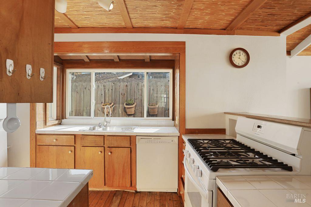 34 Sandy Beach Road Vallejo, CA 94590 - Photo 24 of 63 a kitchen with a stove and a white cabinet