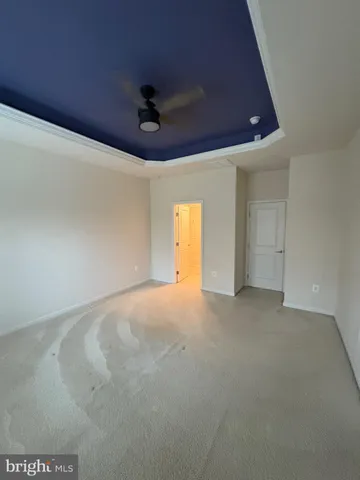 a bathroom with a granite countertop bathtub sink vanity and mirror
