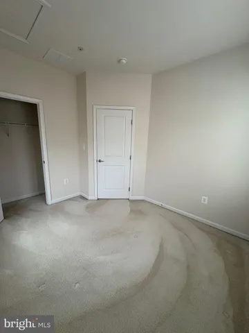 a view of a house with wooden deck
