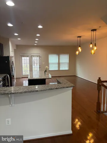 a kitchen with a sink and a refrigerator